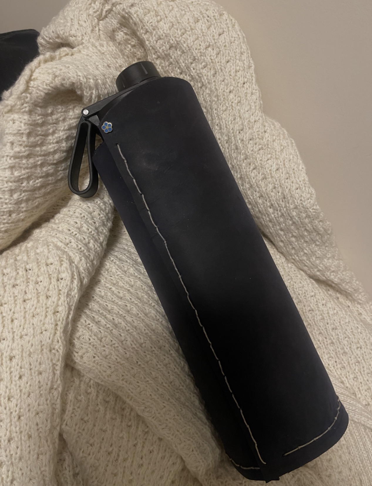 Black handmade sleeve on cream knit